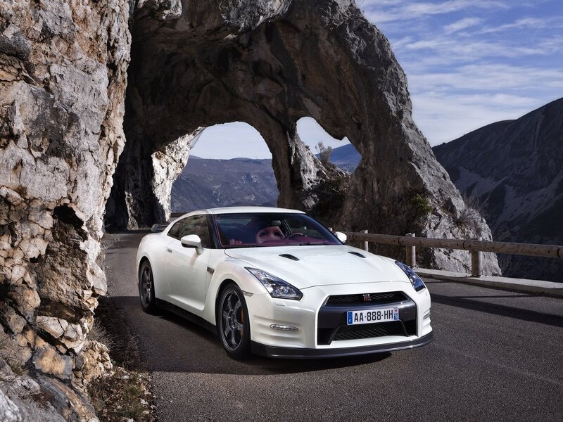 White Nissan GT-R under rock arch