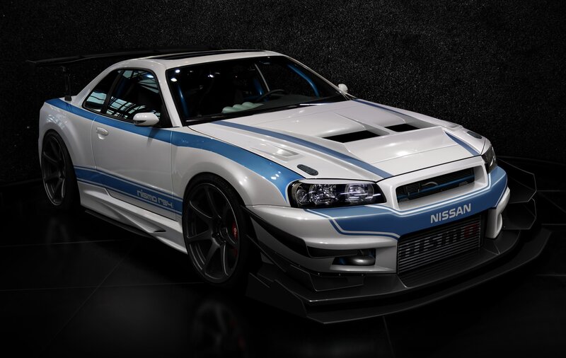 white nissan gt-r with blue stripes