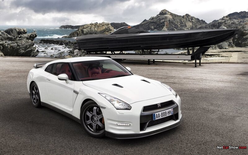 White Nissan GT-R with boat