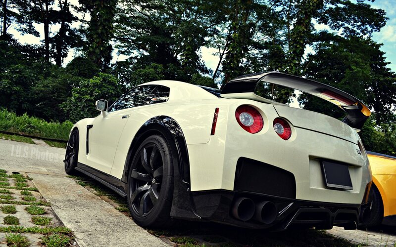 White Nissan GT-R with rear wing
