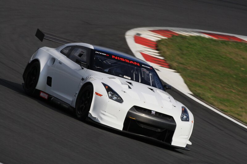 White Nissan race car on track