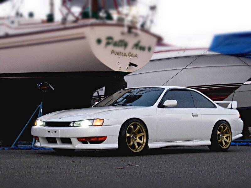 white nissan silvia with gold wheels