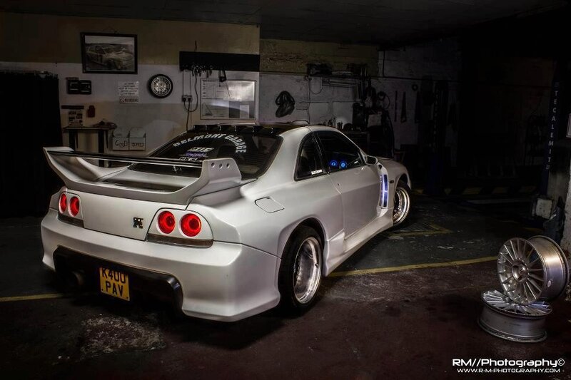 white nissan skyline in garage
