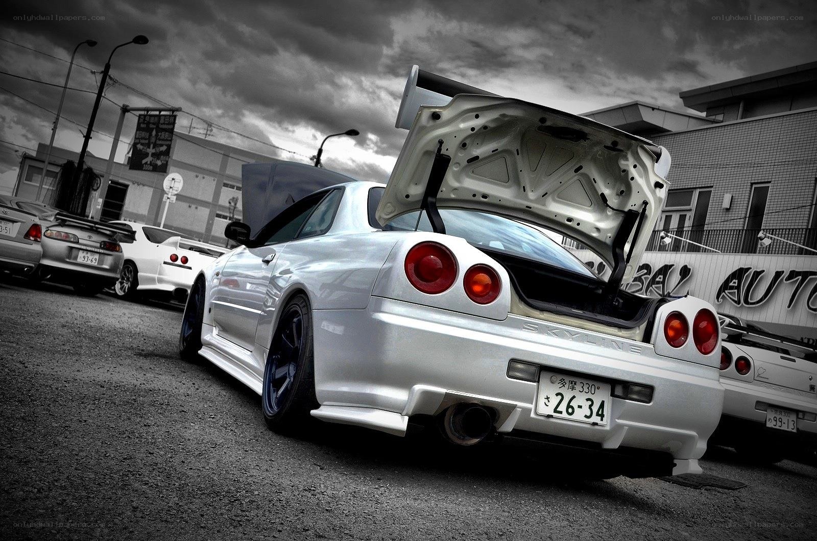 white nissan skyline parked