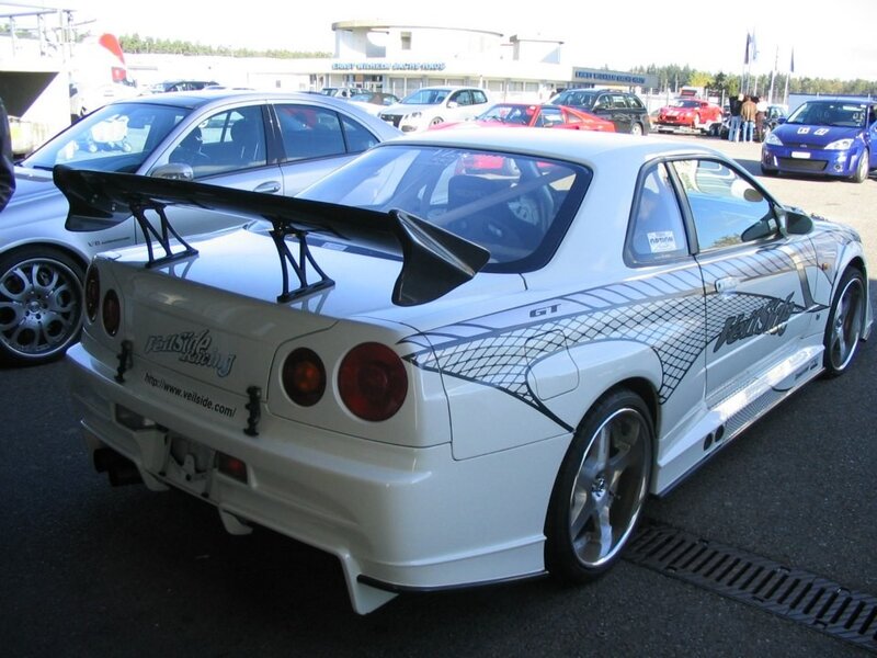 white nissan skyline with rear wing