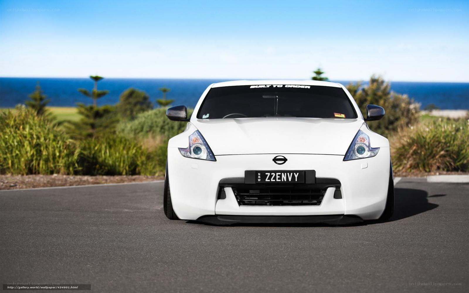 White Nissan Z car by the sea