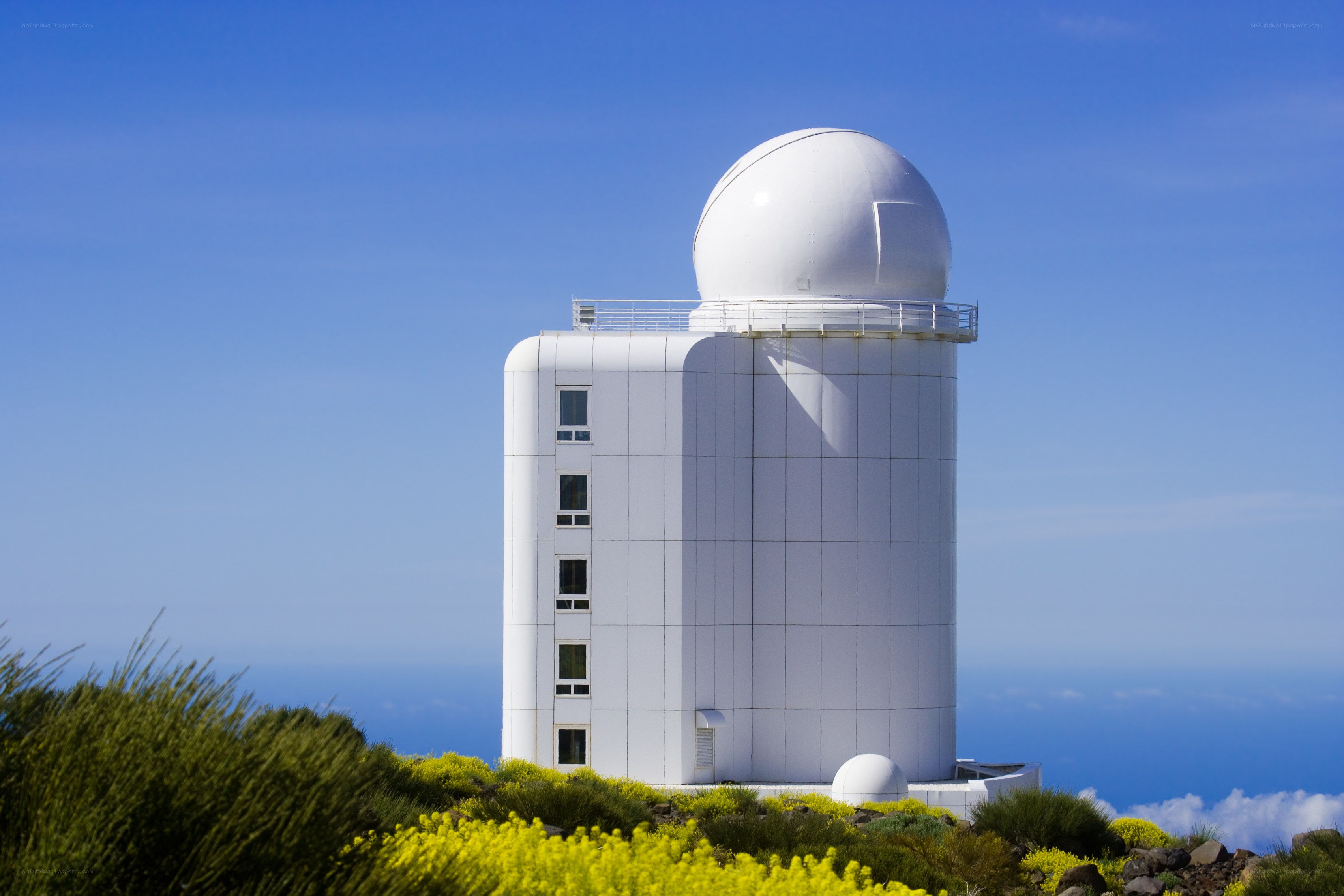 White observatory on a hill