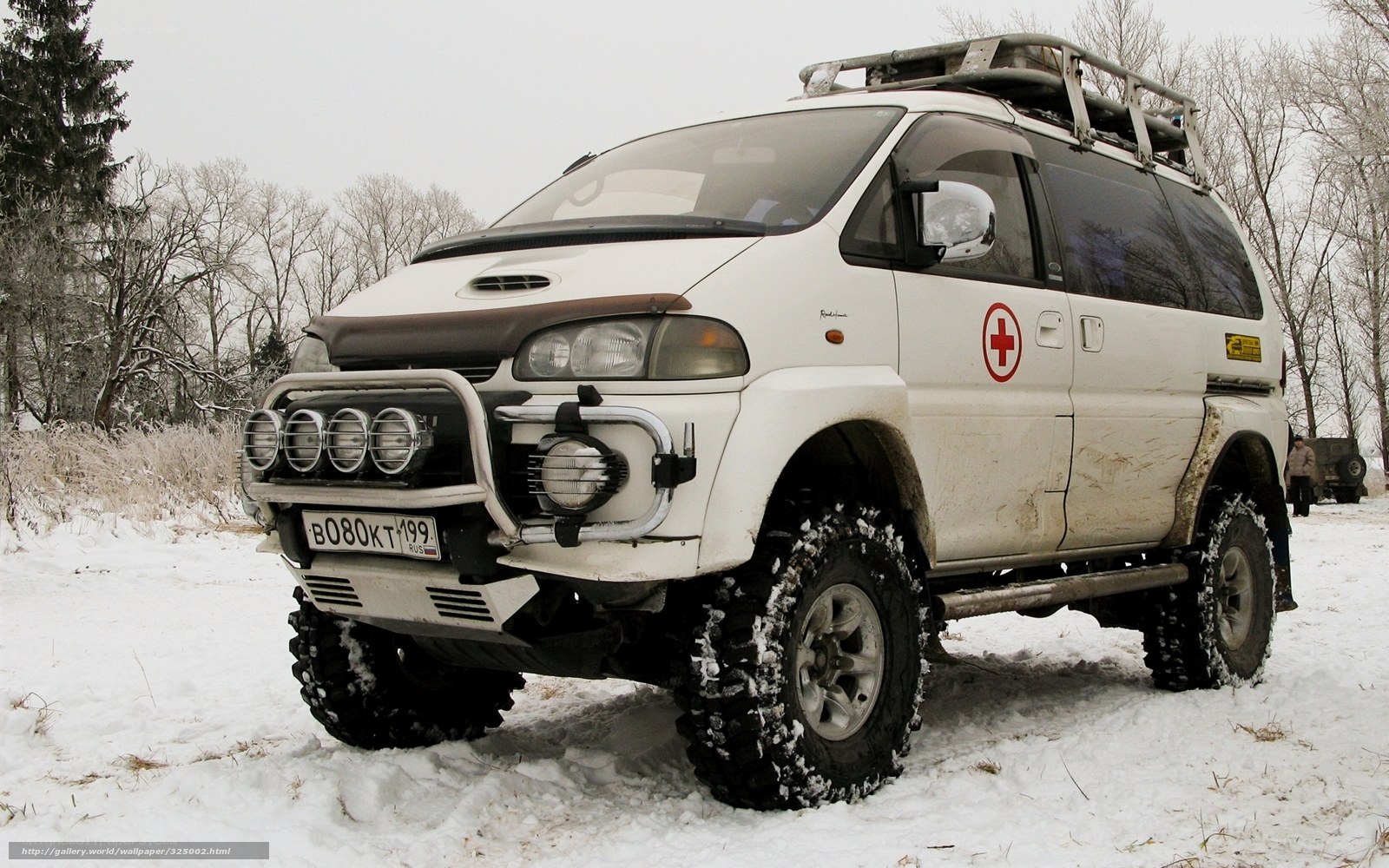 White off-road van in snow