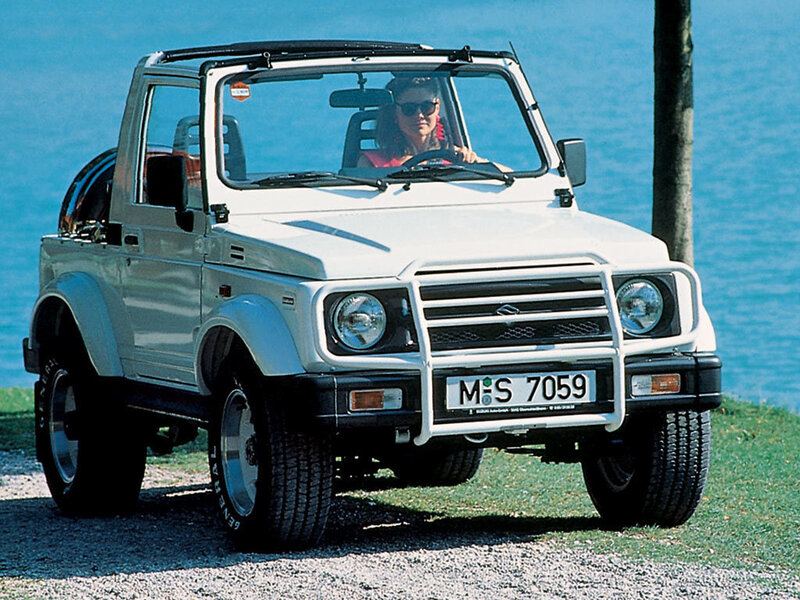 White off-road vehicle by the water