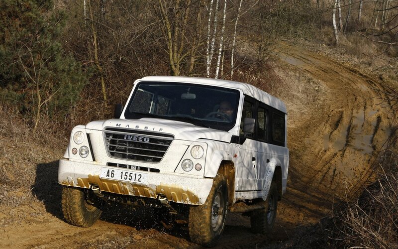 White off-road vehicle on muddy trail