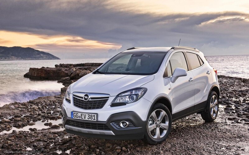 White Opel Mokka by the sea