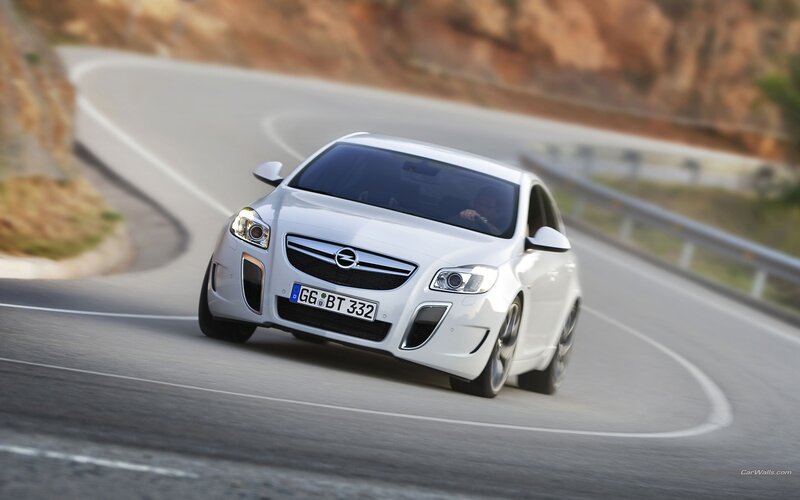 white opel on winding road