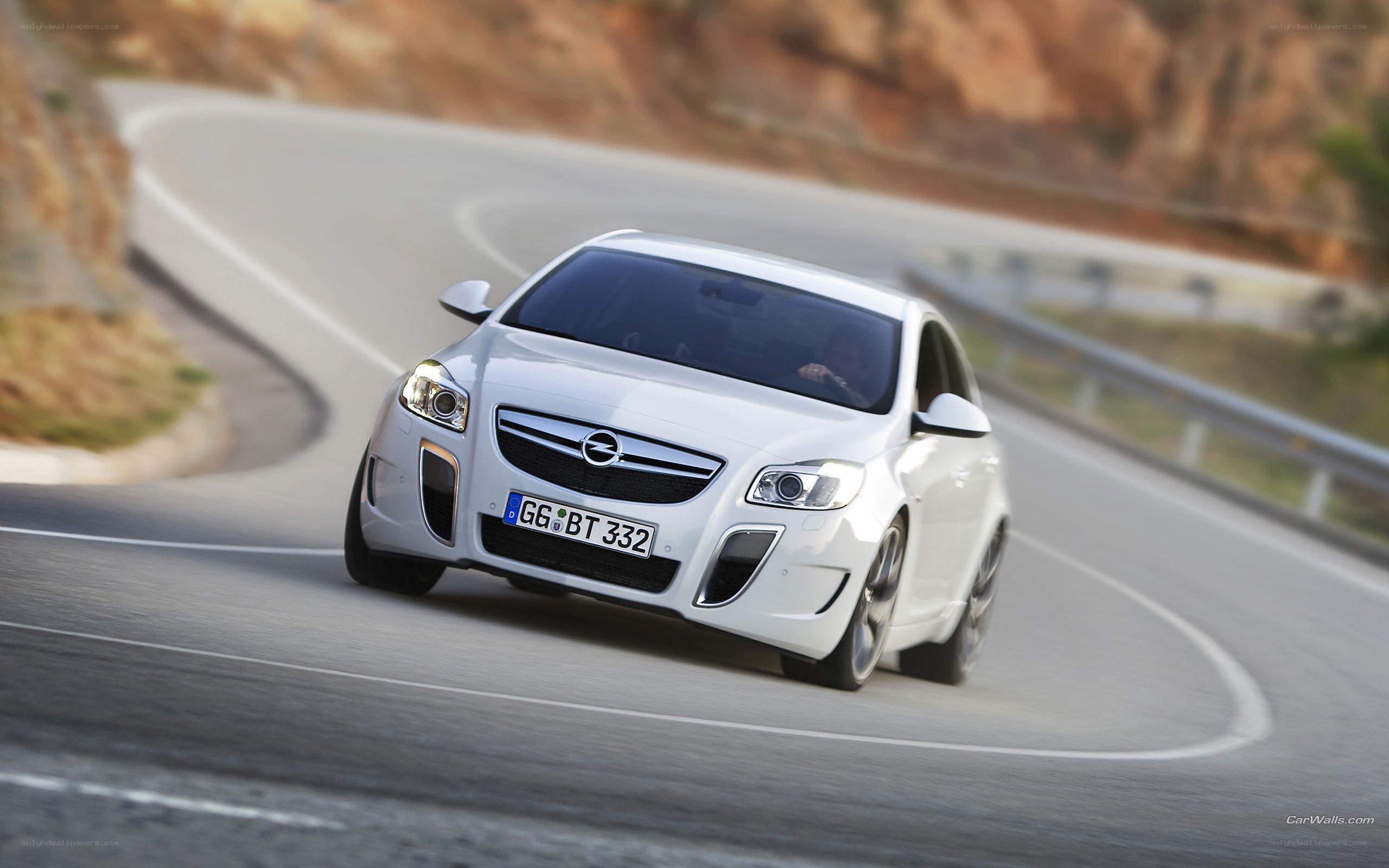 white opel on winding road