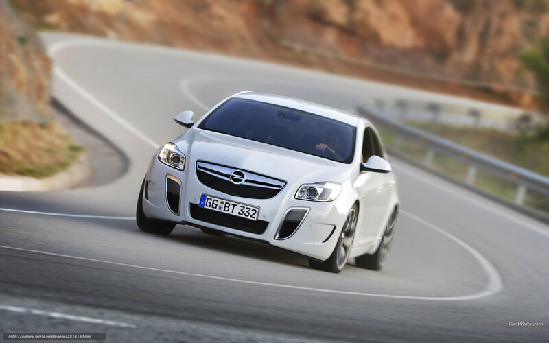 white opel on winding road