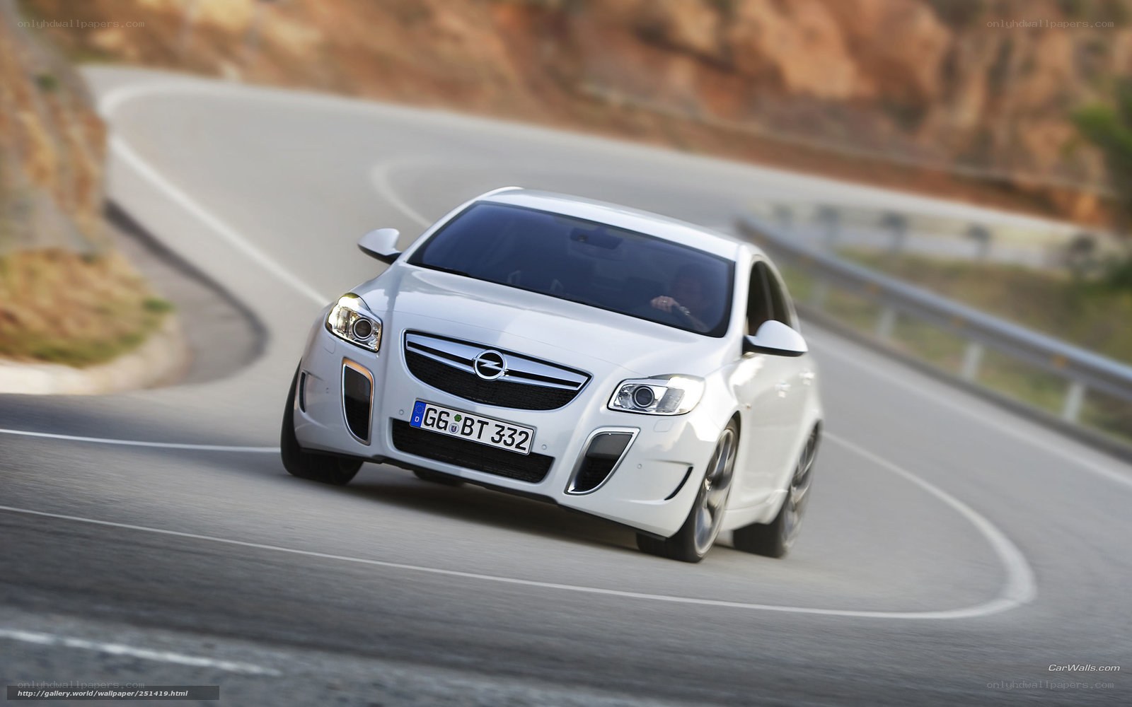 white opel on winding road
