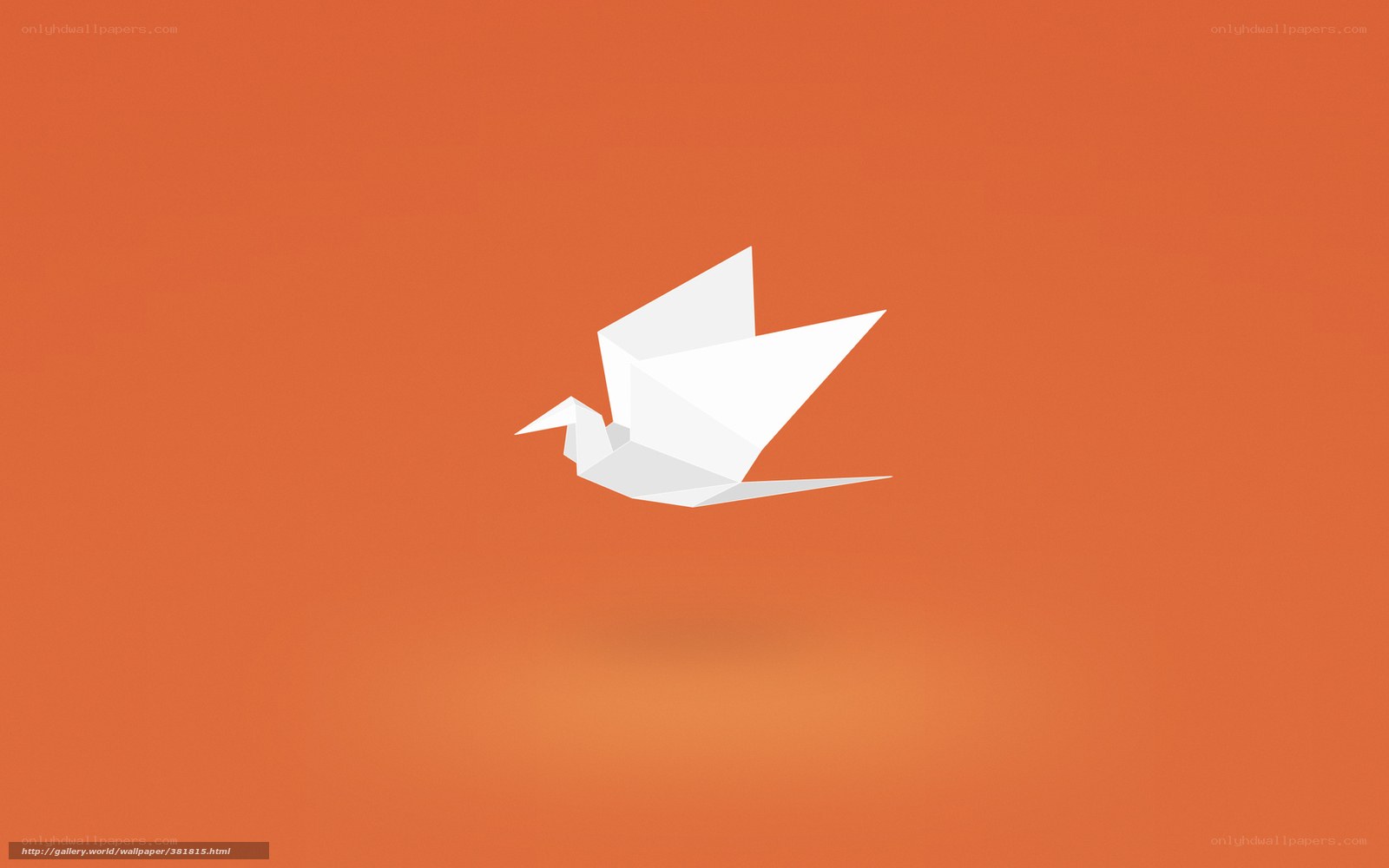 White origami bird on orange