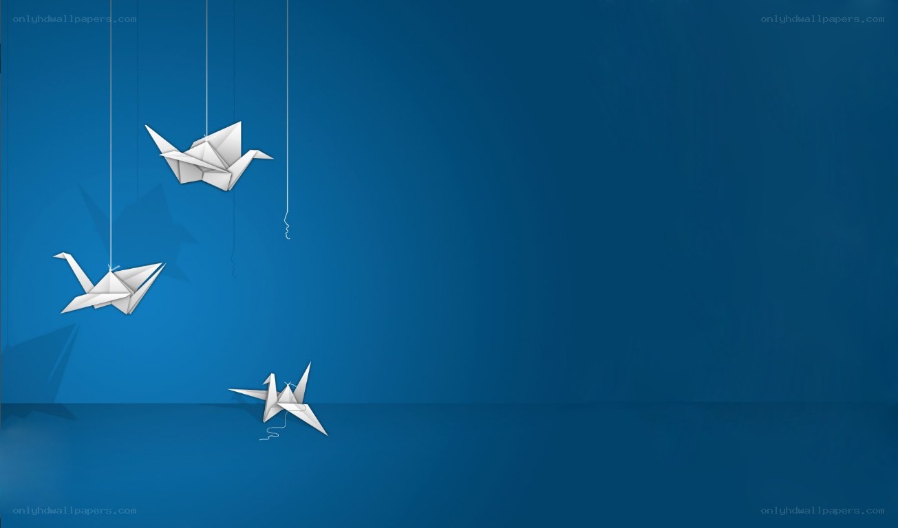 White origami cranes on blue