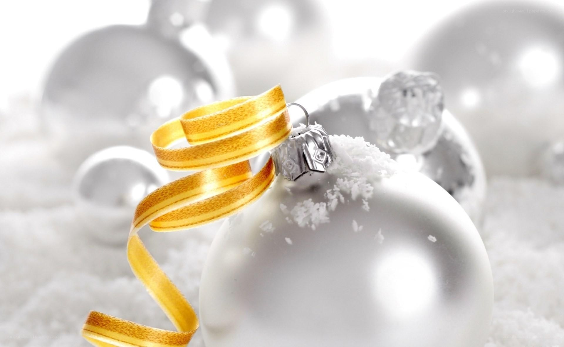 White ornaments with gold ribbon