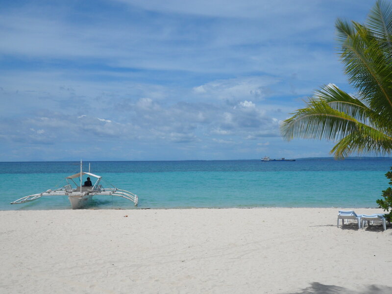 White Outrigger Boat — Blue