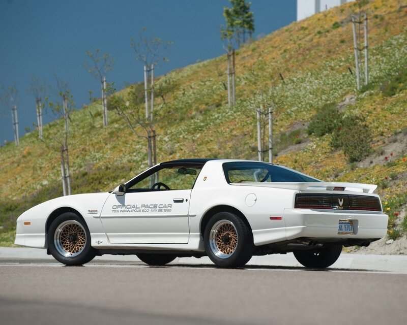 White pace car on a road
