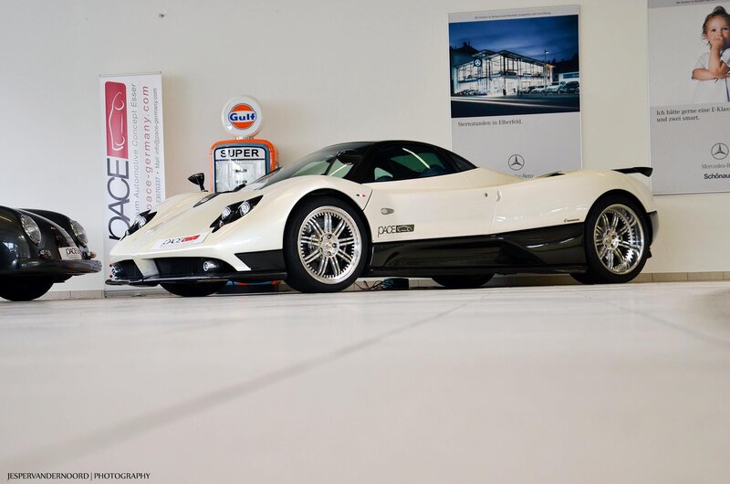 White Pagani sports car in showroom