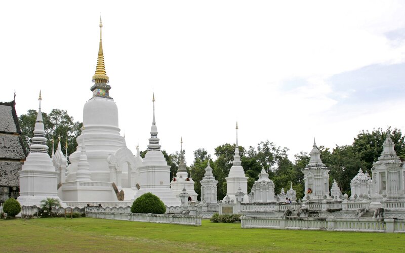White pagodas in a temple complex