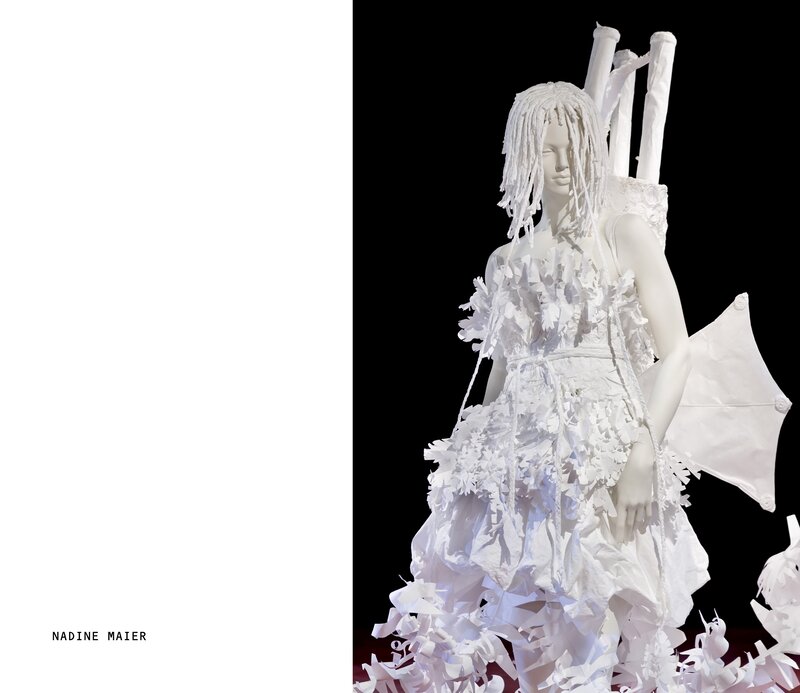 white paper sculpture of a figure