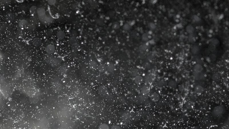 White Particles in Dark Liquid