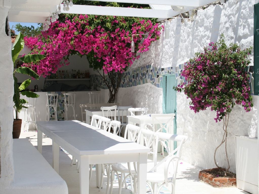 White patio with pink flowers