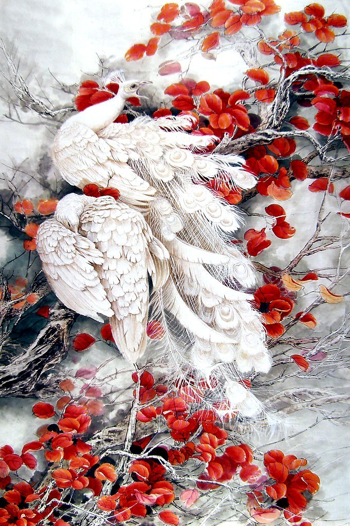 White peacocks in autumn foliage