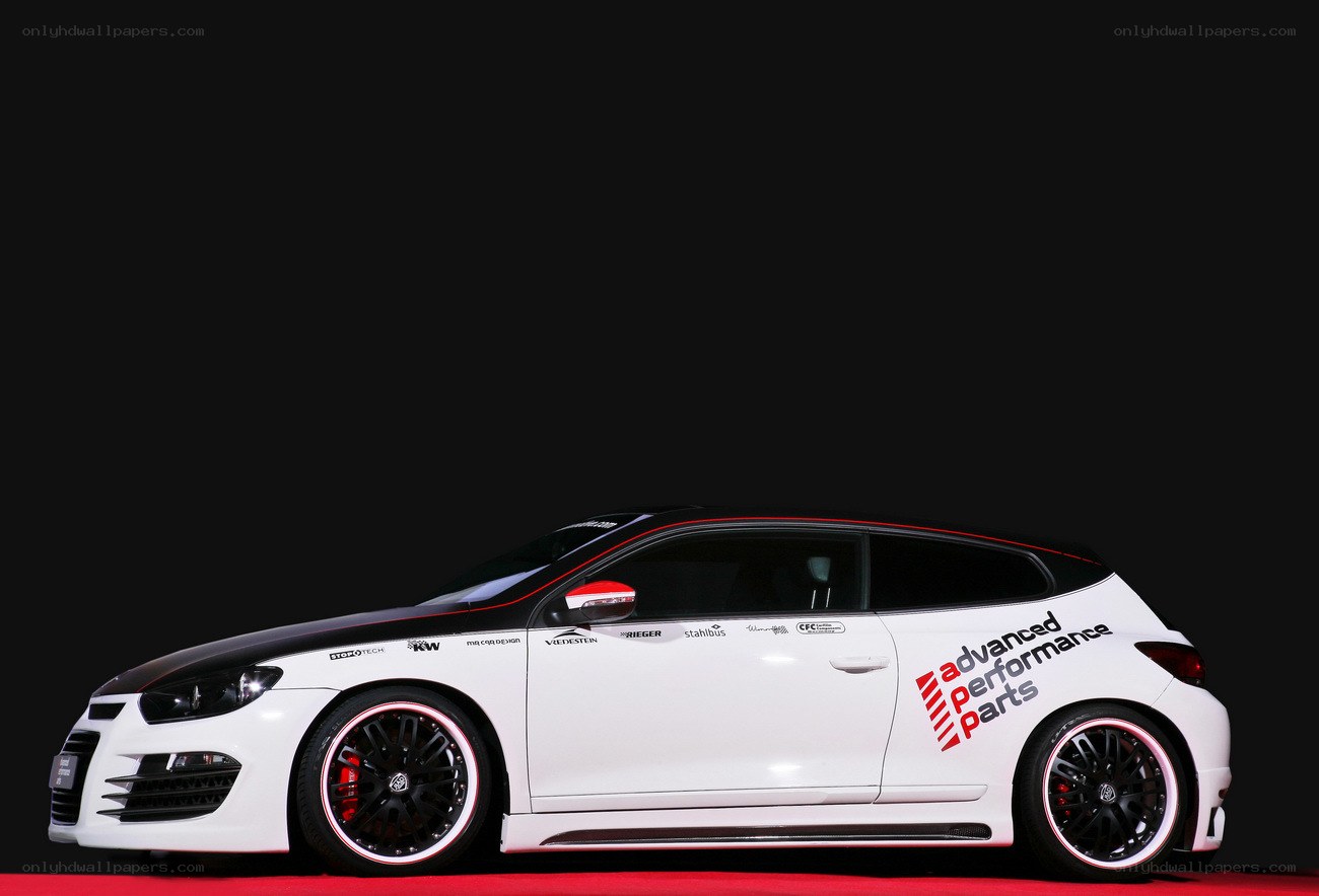 white performance car on red carpet
