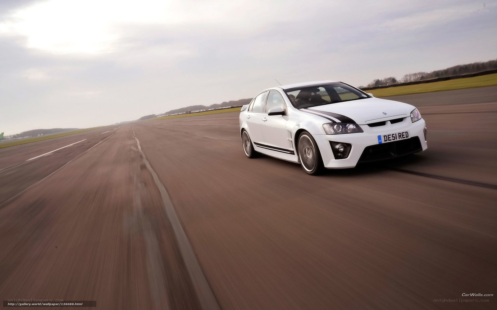 white performance car on track