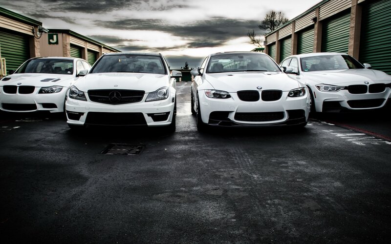 white performance cars lined up
