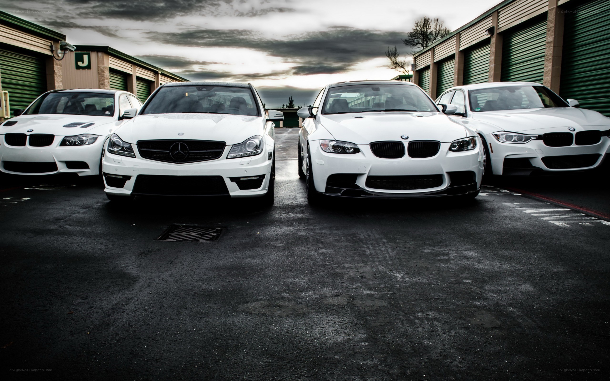 white performance cars lined up