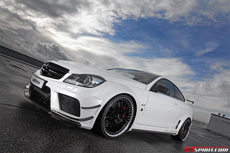 white performance coupe on track