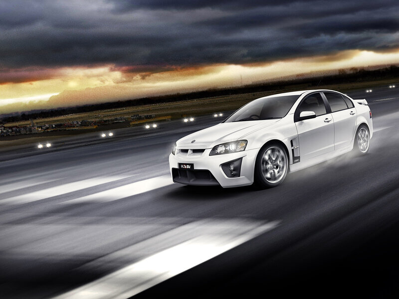 White Performance Sedan — Dramatic, Sunset