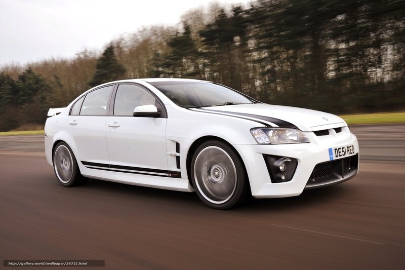 white performance sedan in motion