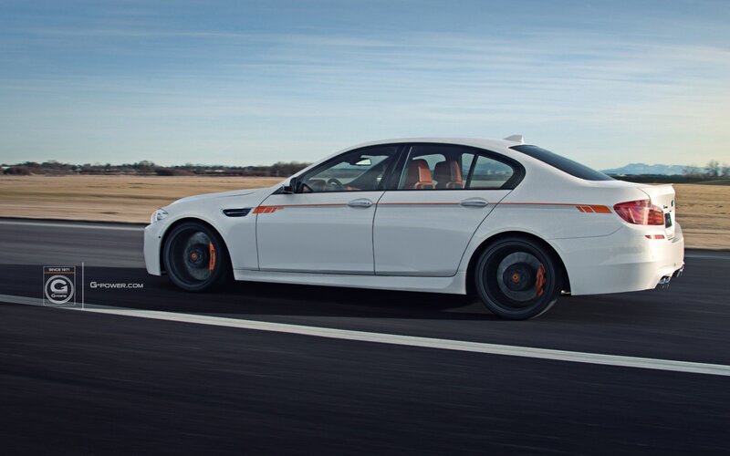 white performance sedan on track