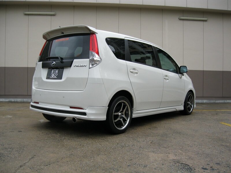 white perodua alza minivan