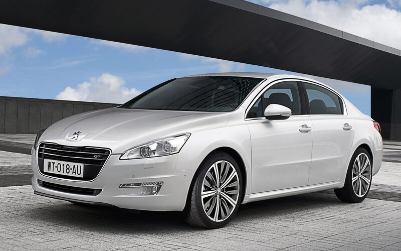 white peugeot sedan car
