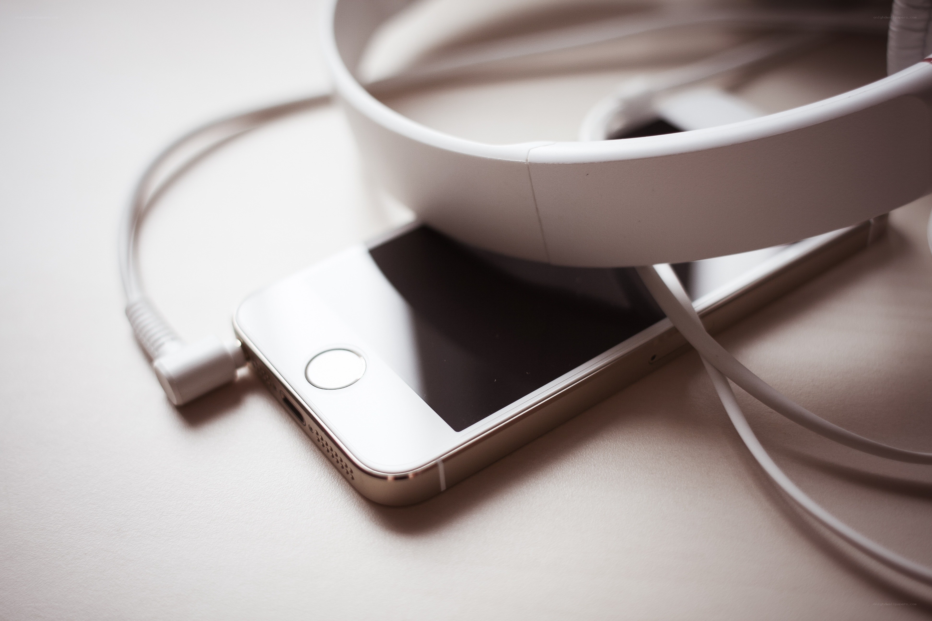 white phone with headphones