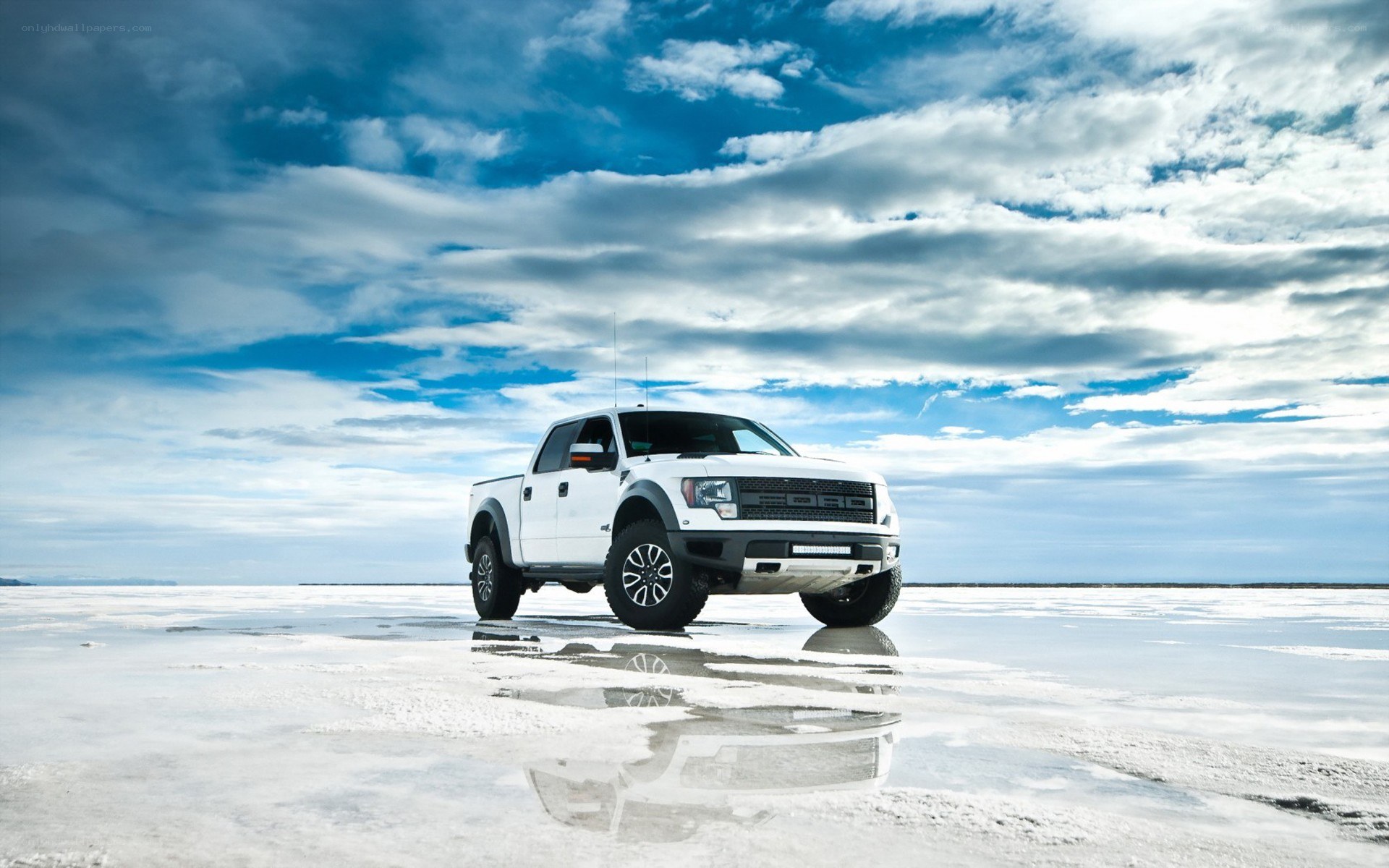 White pickup on salt flat