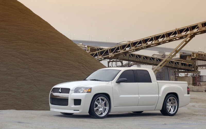 white pickup truck at industrial site