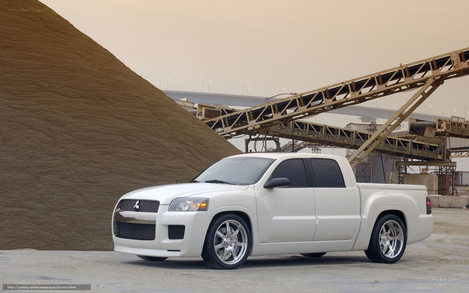 white pickup truck at industrial site
