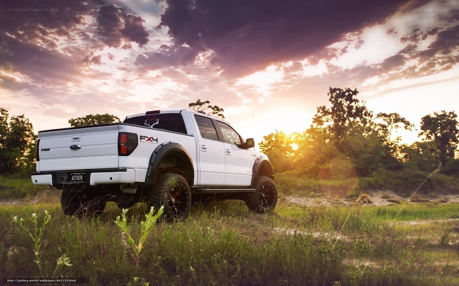 White pickup truck at sunset