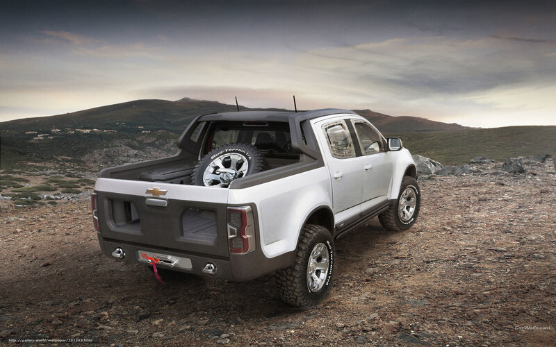 White pickup truck in rugged terrain
