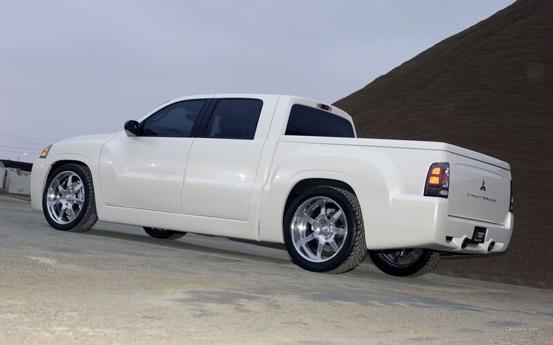 white pickup truck on gravel