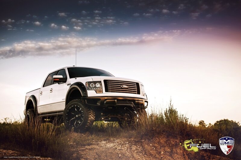 white pickup truck on hill