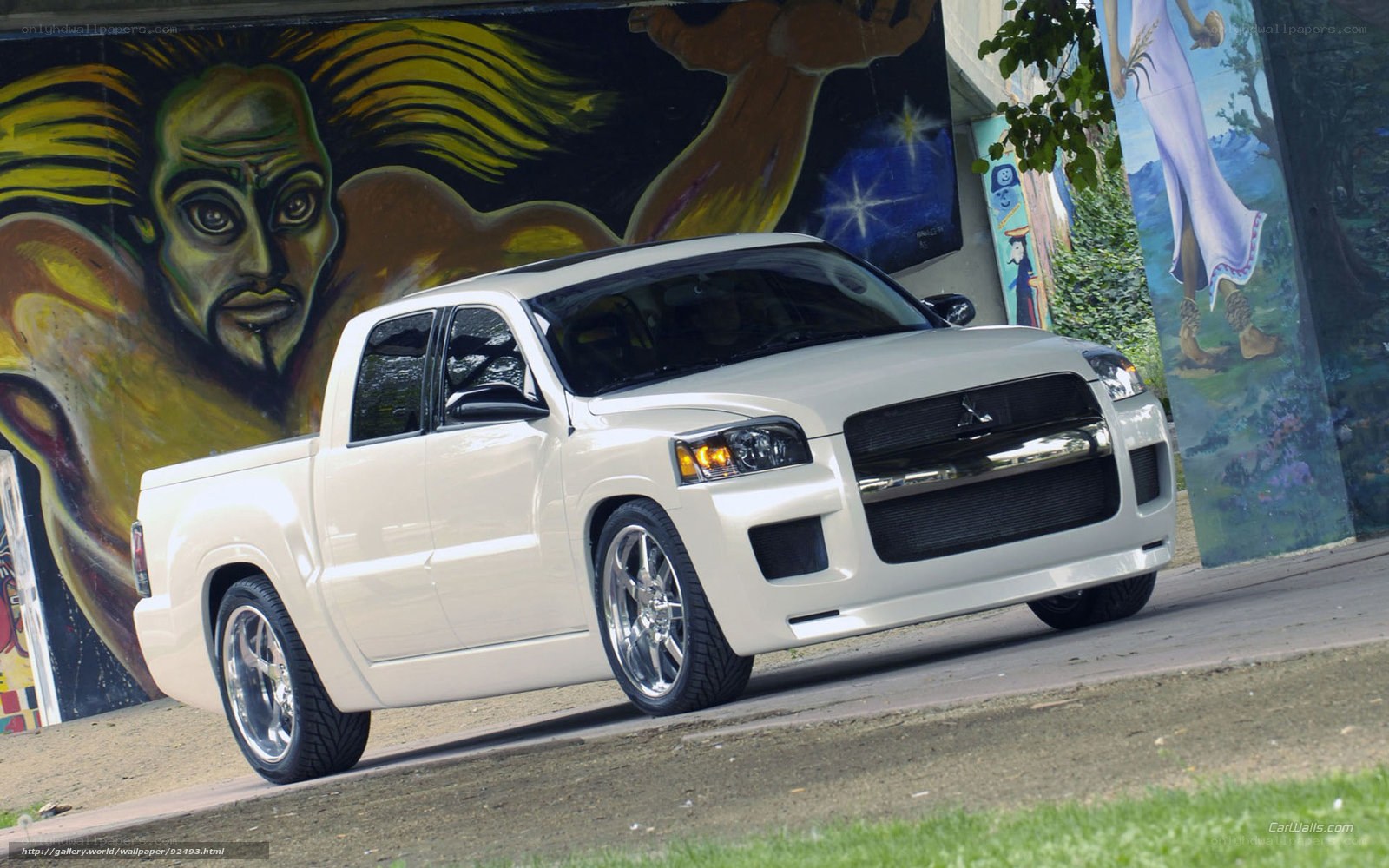 white pickup truck with custom wheels