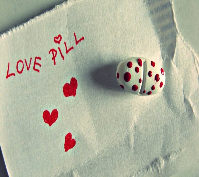 White Pill with Red Dots